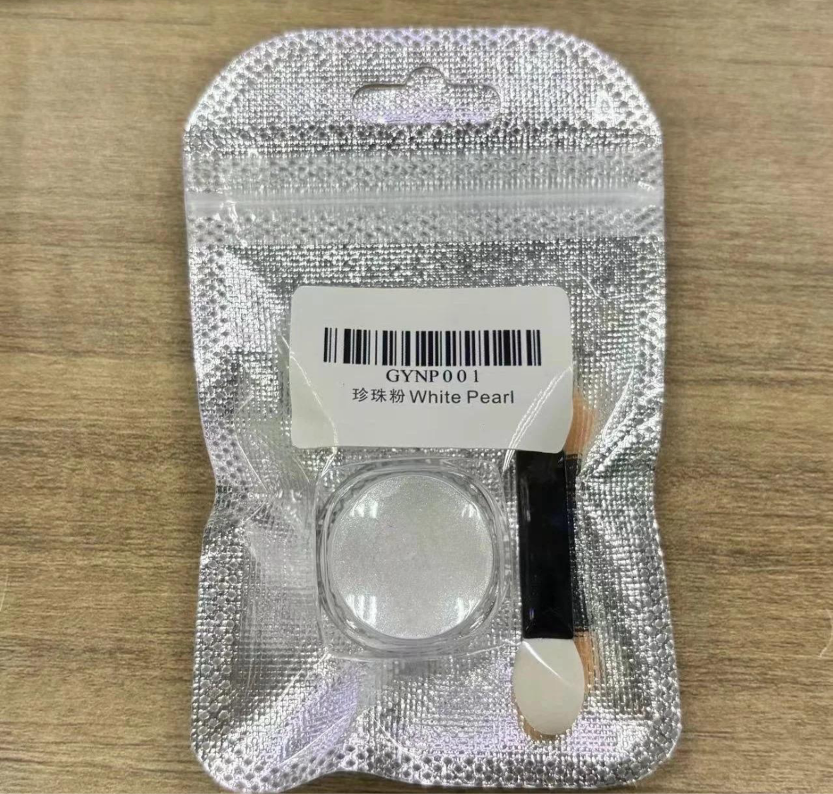 Polvo blanco perlado para uñas